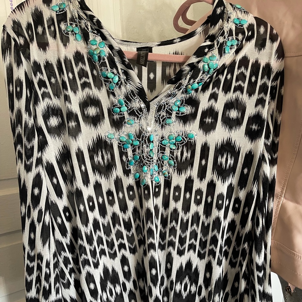 nice long mesh black and white shirt with some beautiful blue beads on the chest